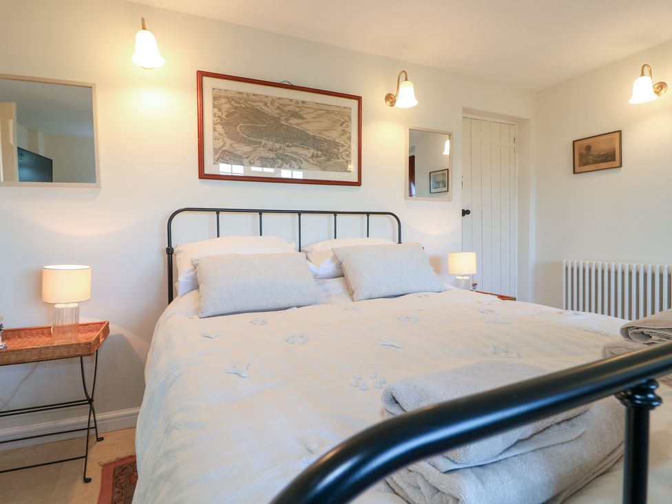 A bedroom with a bed and lamps at Gapstile in Abbots Bromley