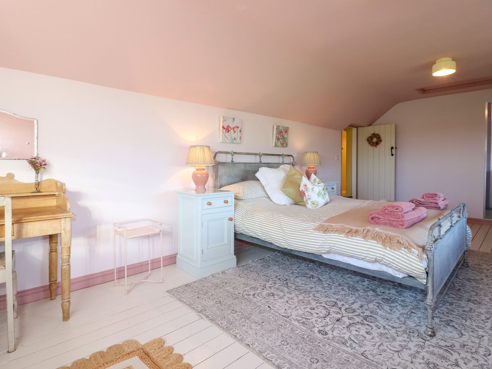 A bedroom with a bed and nightstand at Gapstile Abbots Bromley