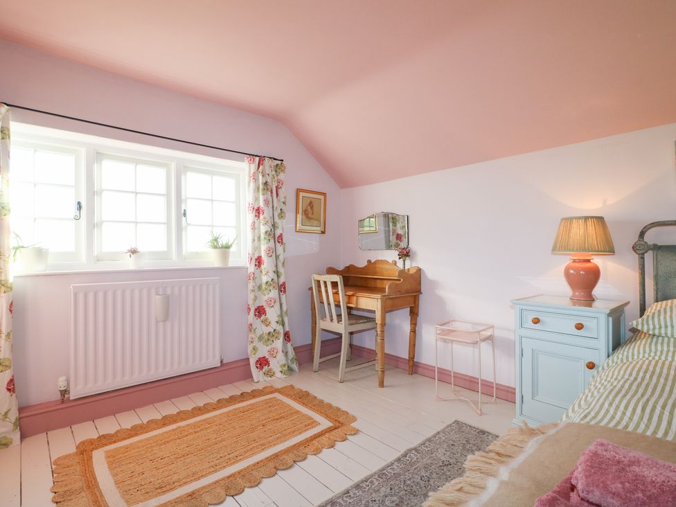 A bedroom with a desk and lamp at Gapstile in Abbots Bromley