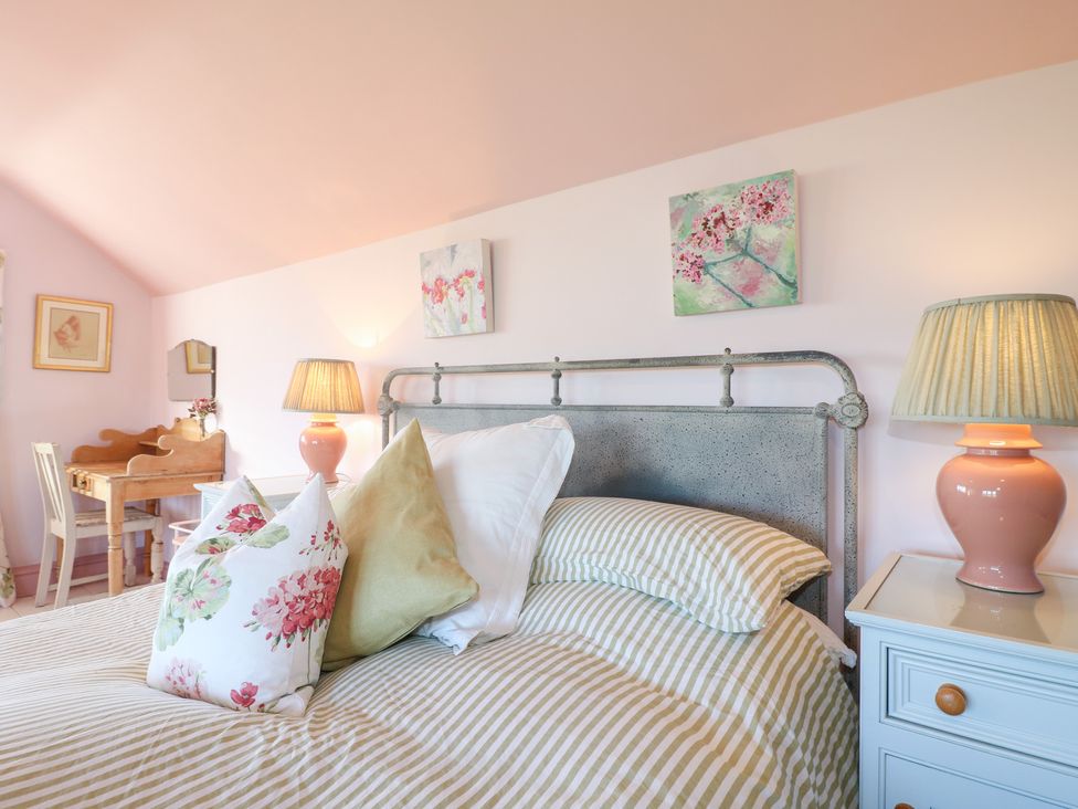 A bedroom with a bed and small desk at Gapstile in Abbots Bromley