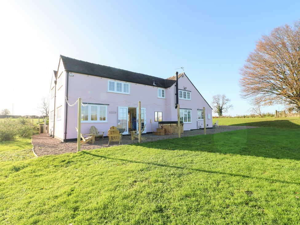 A house with chairs in the garden at Gapstile in Abbots Bromley