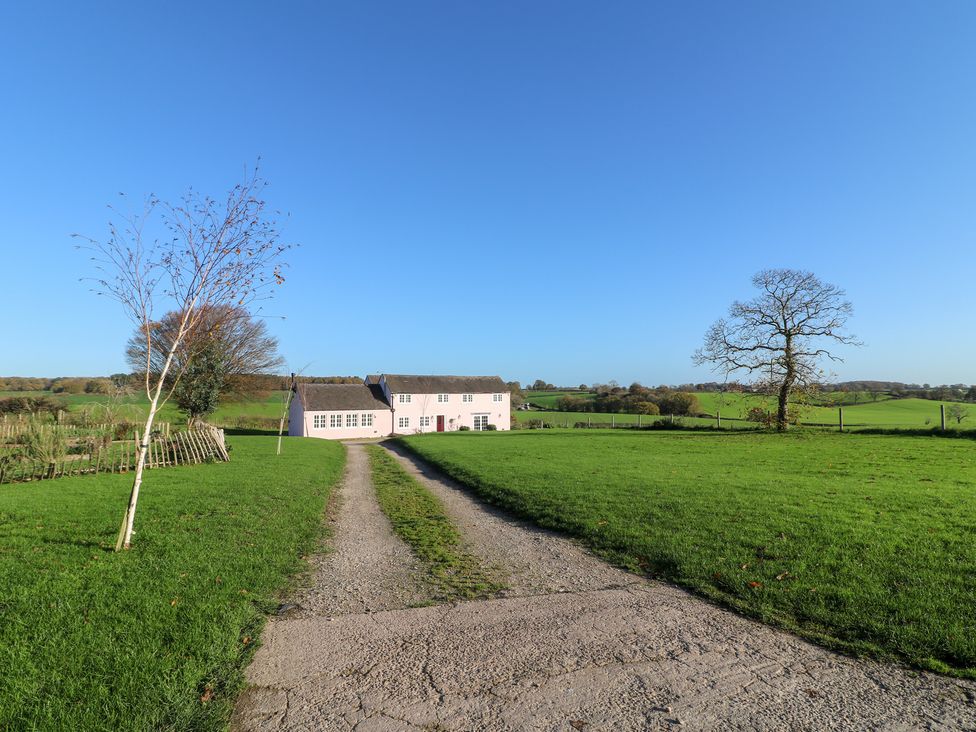 A house with a driveway and surrounding greenery at Gapstile in Abbots Bromley