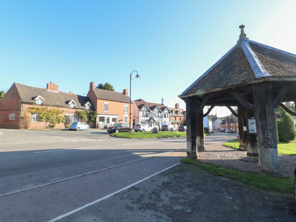 A street view with houses and a wooden structure at Gapstile in Abbots Bromley