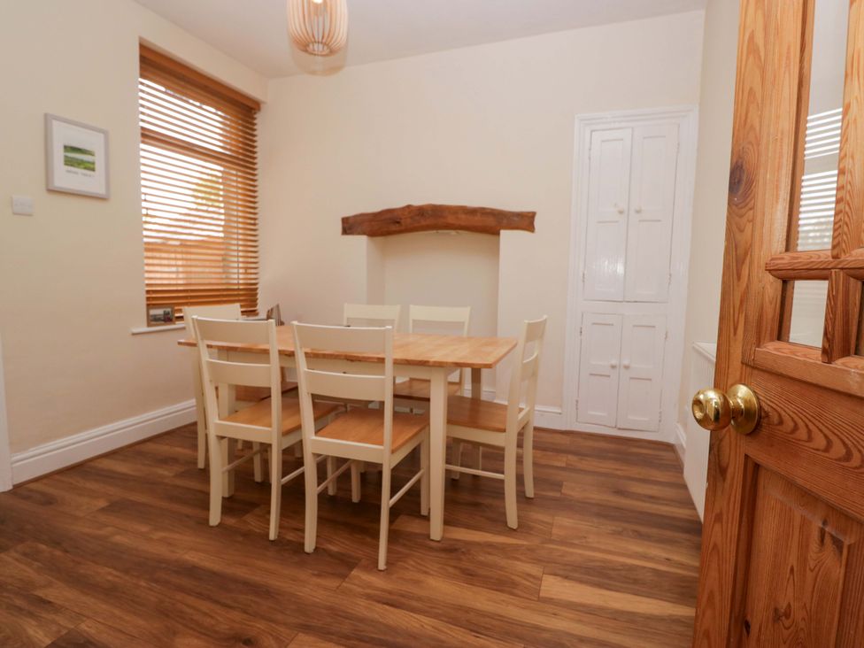 A dining room with a table and chairs at 28 Rock Villas Carnforth