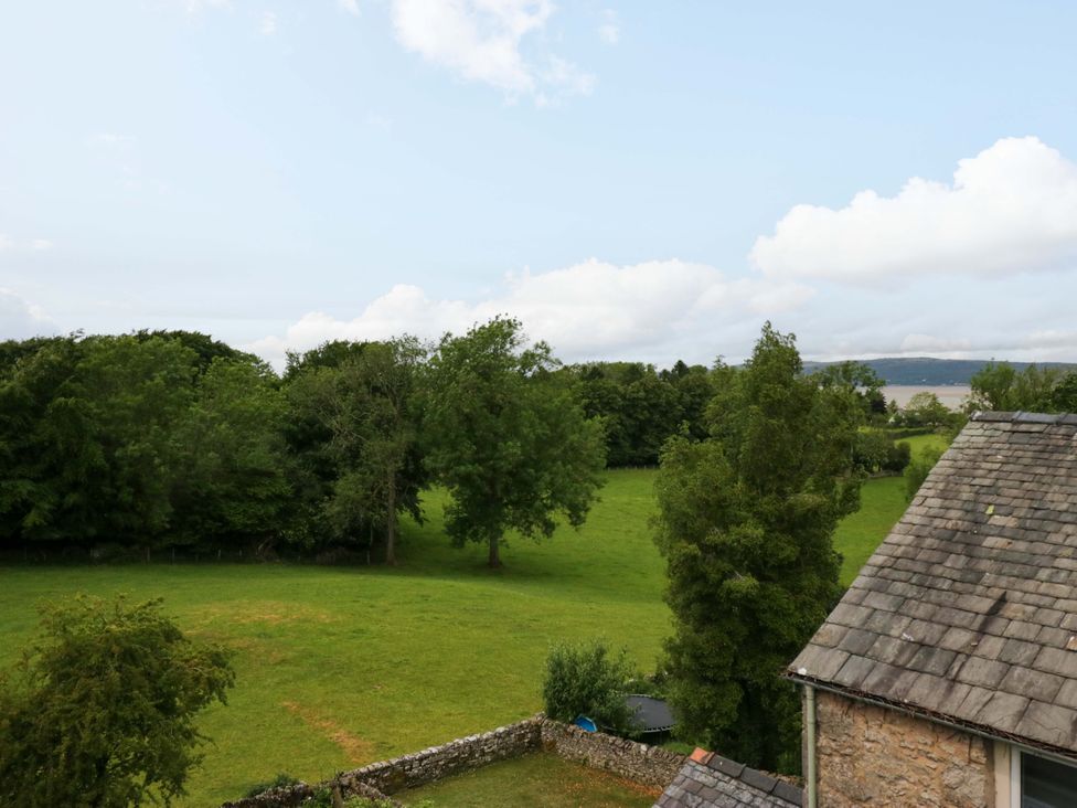 A view of trees and a grassy field at 28 Rock Villas in Carnforth