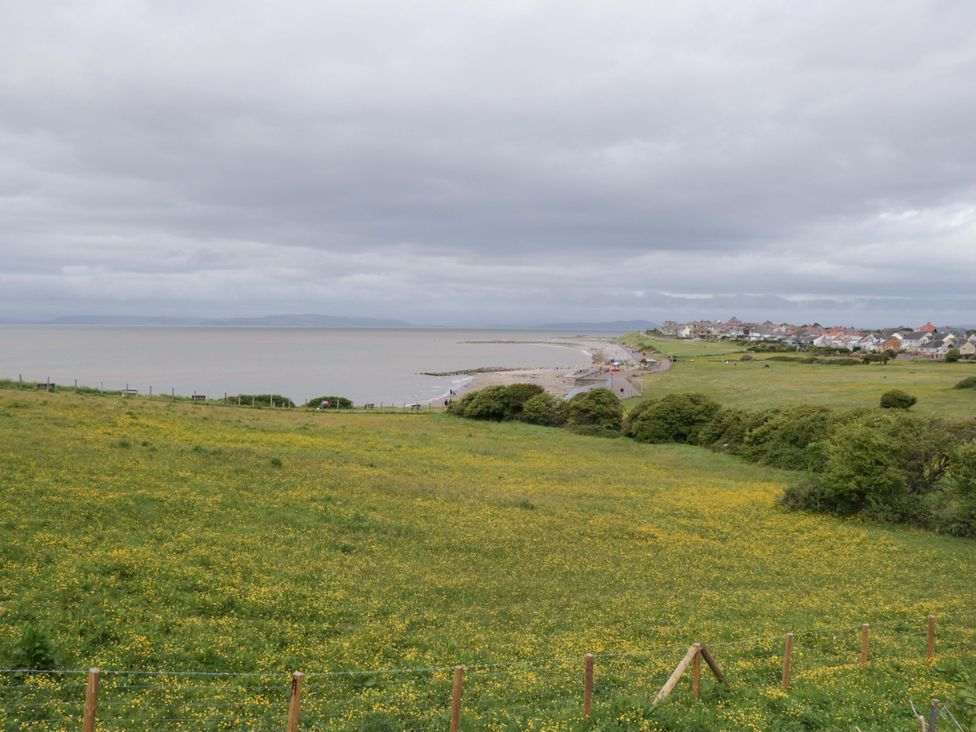 A coastal view with sea and grassland at 28 Rock Villas in Carnforth