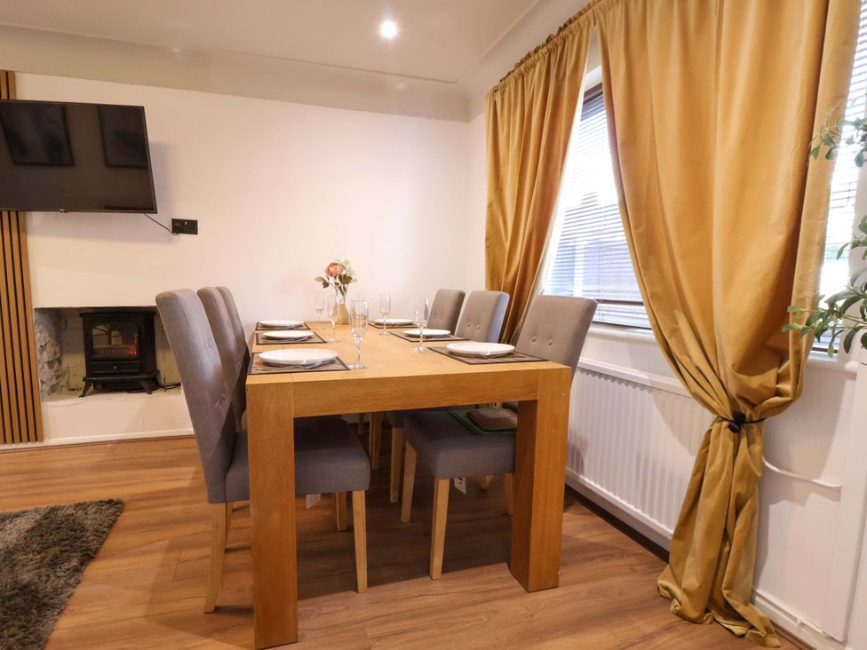 A dining room with a table and chairs at The Cloud House @ Hoole in Chester