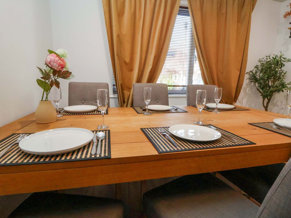 A dining room with a table set for meal at The Cloud House @ Hoole in Chester