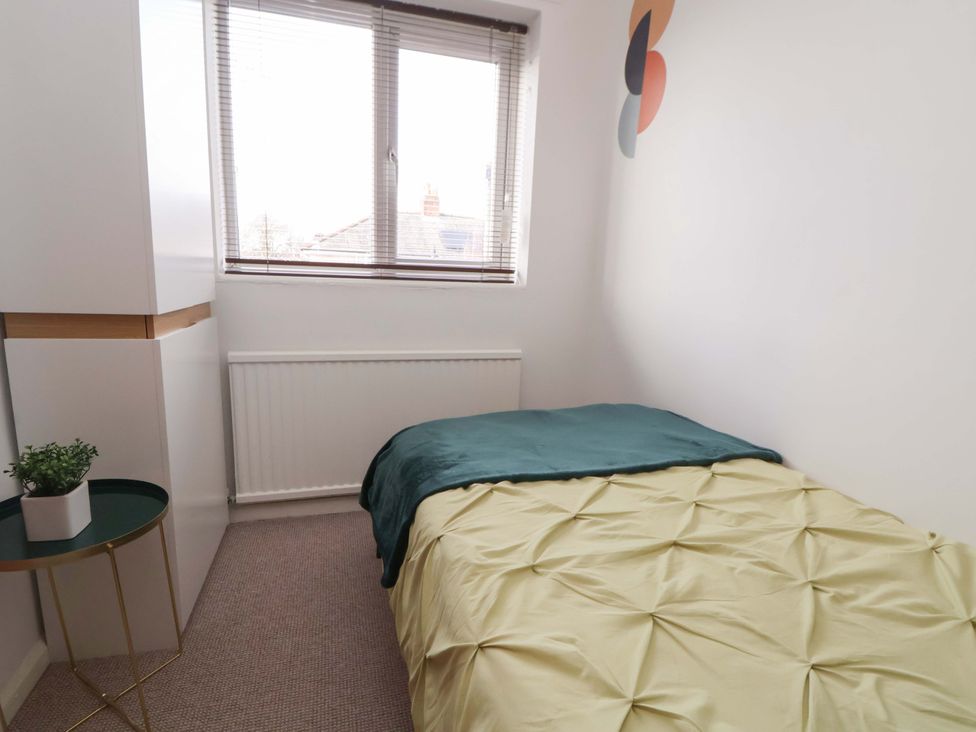 A bedroom with a bed and window at The Cloud House @ Hoole in Chester