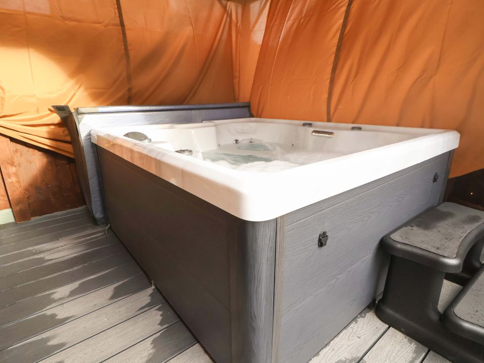A hot tub on wooden deck at The Cloud House @ Hoole in Chester
