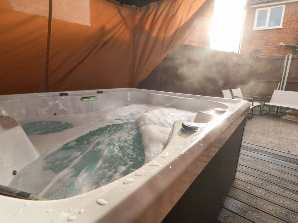 A hot tub with bubbling water and steam at The Cloud House @ Hoole in Chester