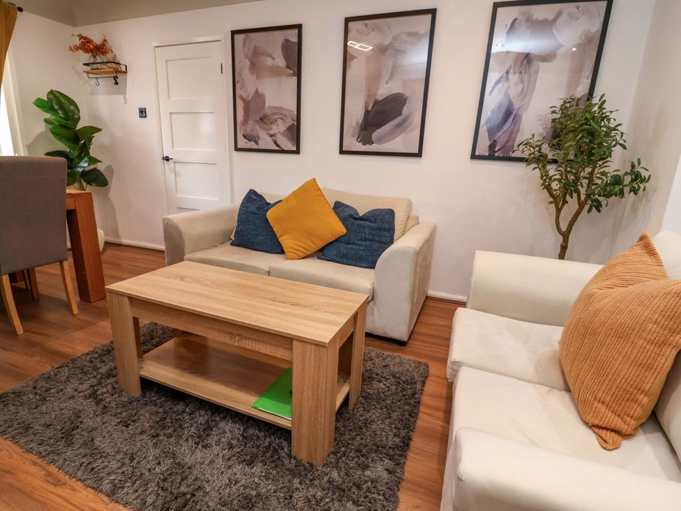A living room with a coffee table and sofas at Steam and Stay @ Hoole in Chester