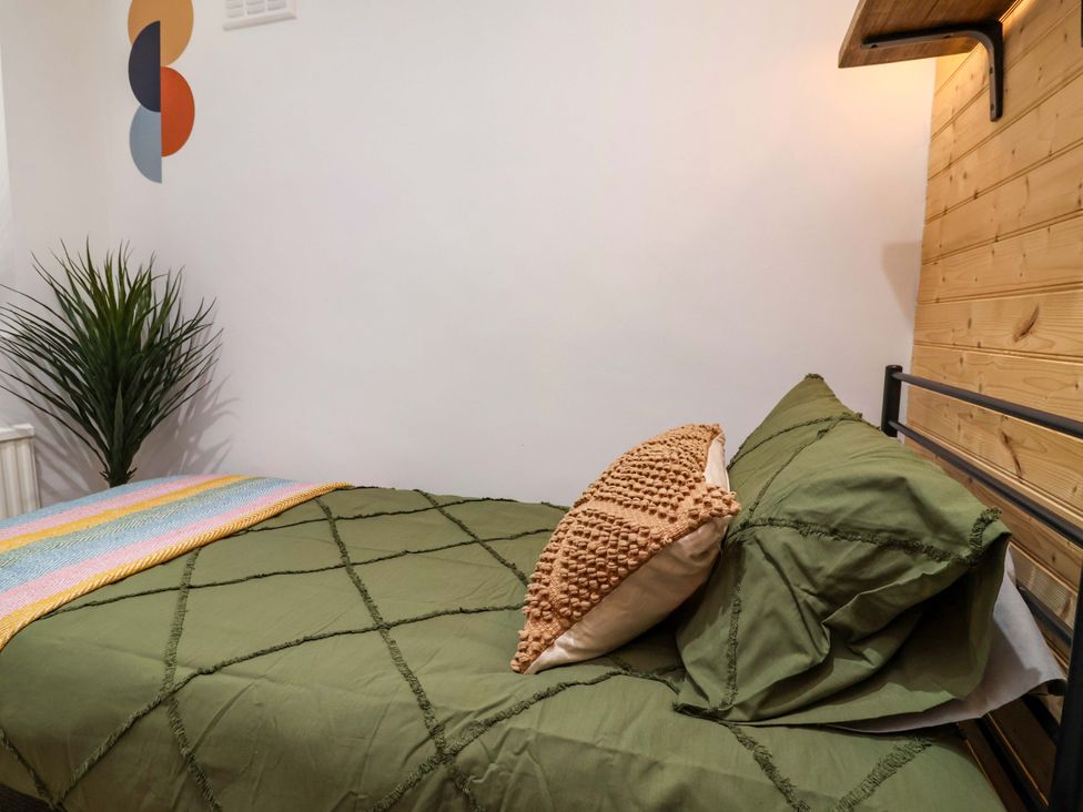 A bedroom with a bed and plants at Steam and Stay @ Hoole in Chester