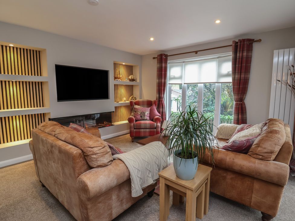 A living room with a sofa and armchair at Little Willesleigh Goodleigh near Barnstaple