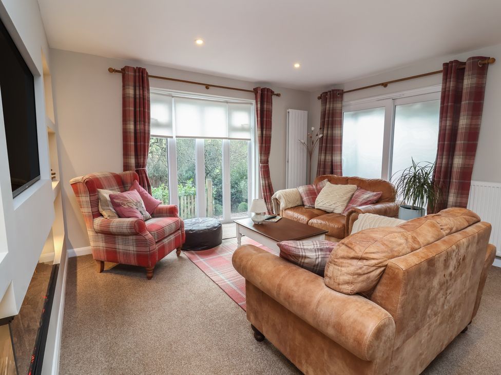A living room with a sofa and armchair at Little Willesleigh Goodleigh near Barnstaple