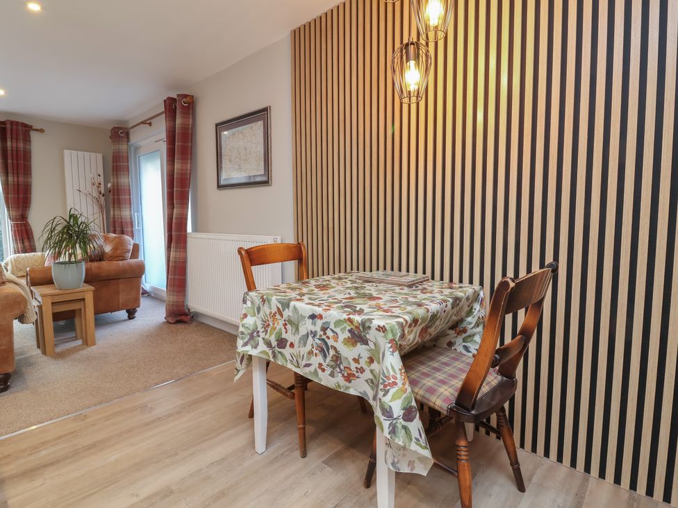 A dining room with a table and chairs at Little Willesleigh Goodleigh near Barnstaple