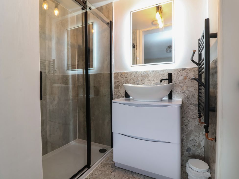 A bathroom with a shower and sink at Little Willesleigh Goodleigh near Barnstaple