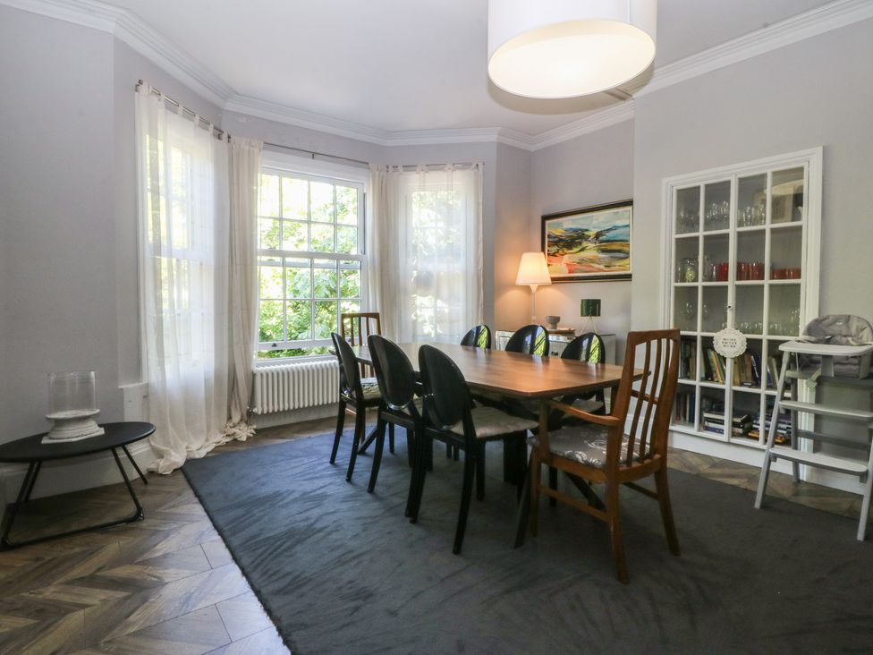 A dining room with a table and chairs at Gweryl Lodge in Conwy