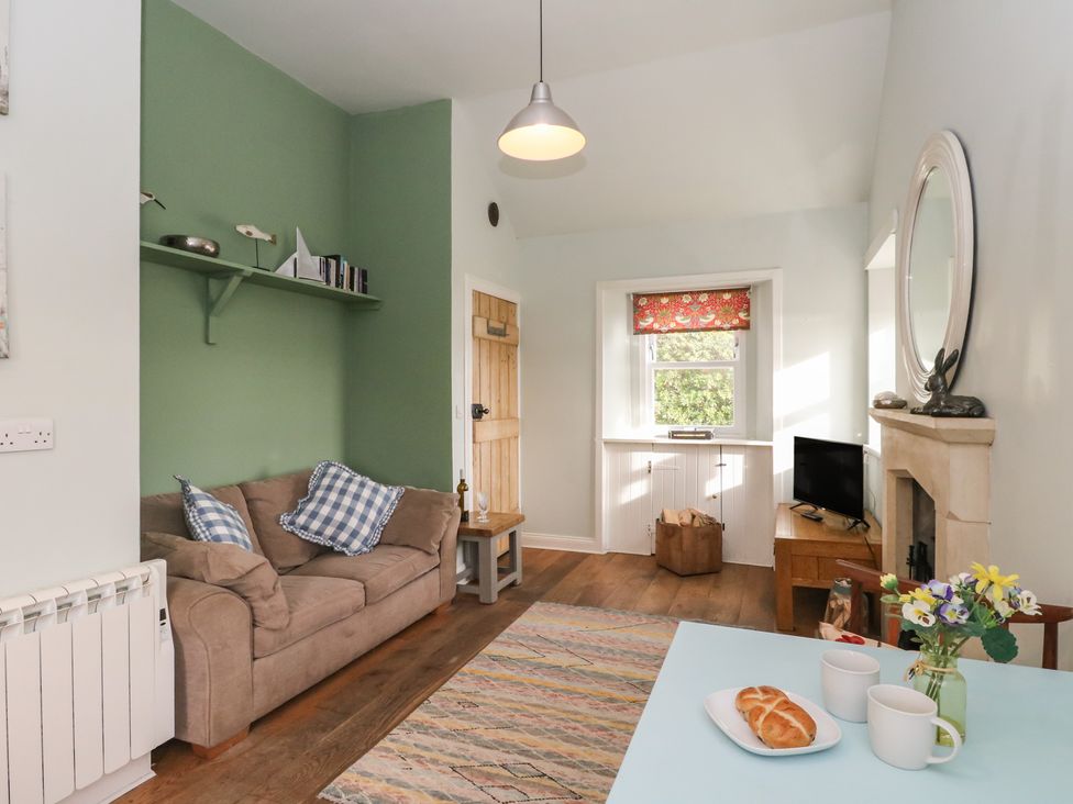 A living room with a sofa and coffee table at South Lodge in Ardpatrick near Tarbert
