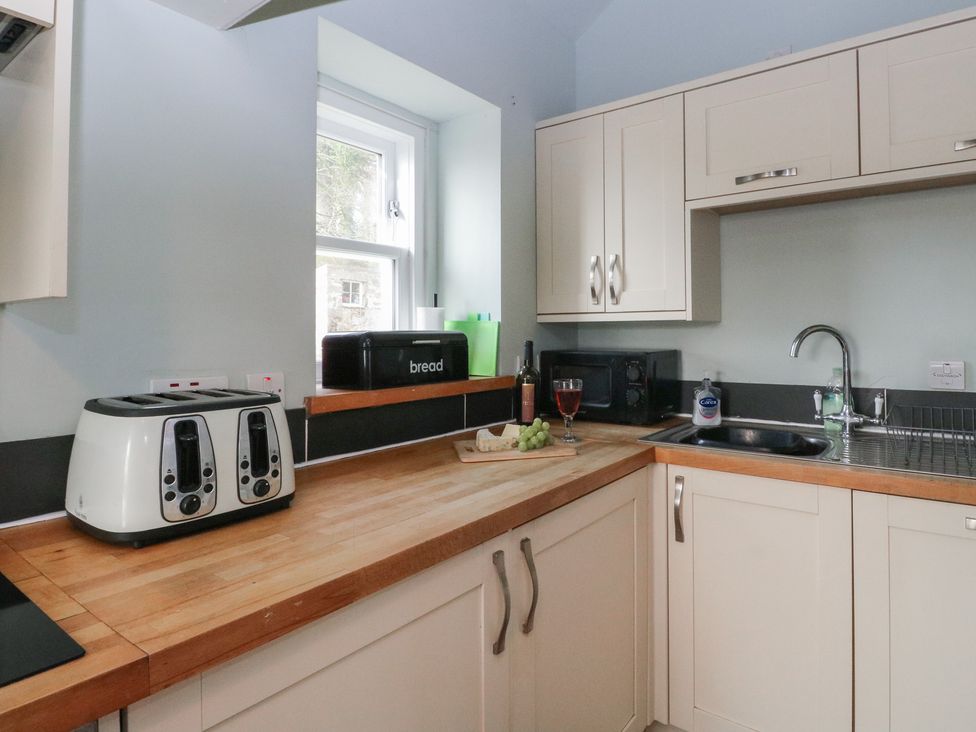 A kitchen with appliances and a wooden countertop at South Lodge in Ardpatrick near Tarbert