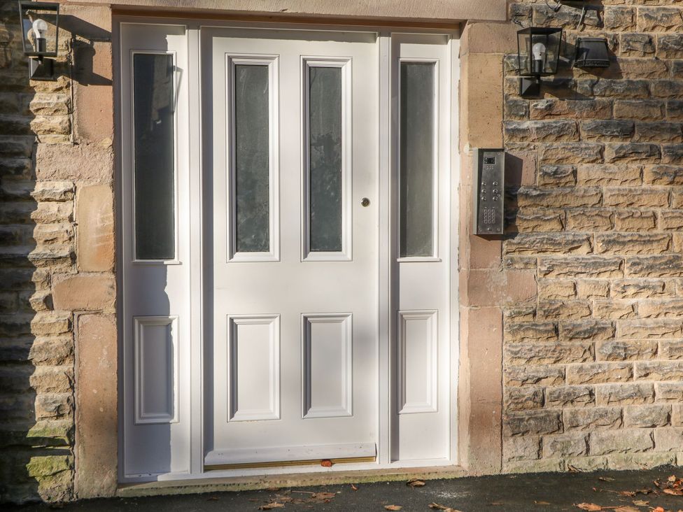 A front door and intercom at Pavilion Suite in Buxton