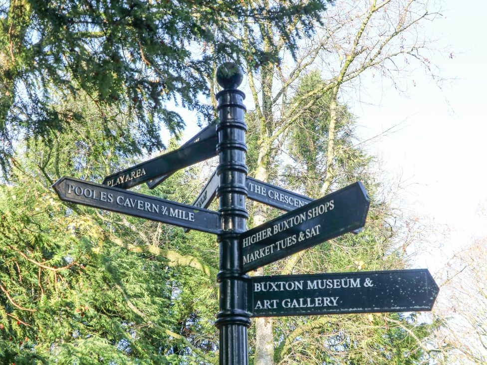 A signpost with directions to various attractions in Buxton