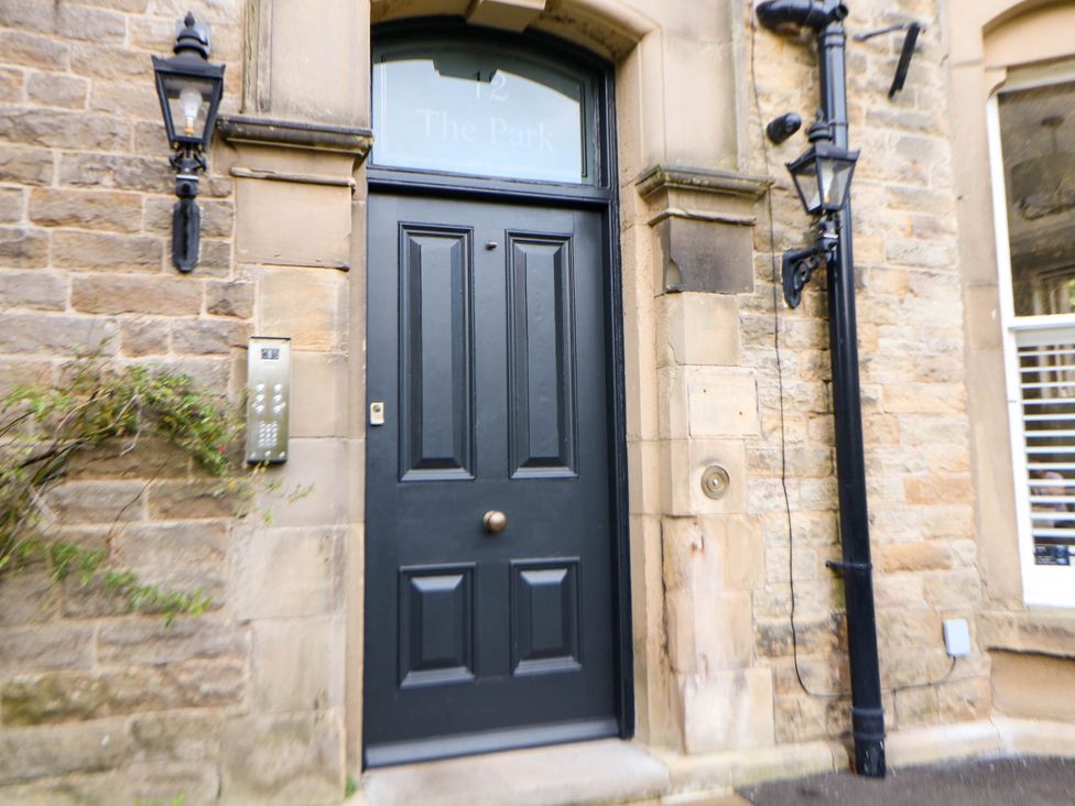 An entrance door with a doorbell and intercom at Pavilion Suite in Buxton