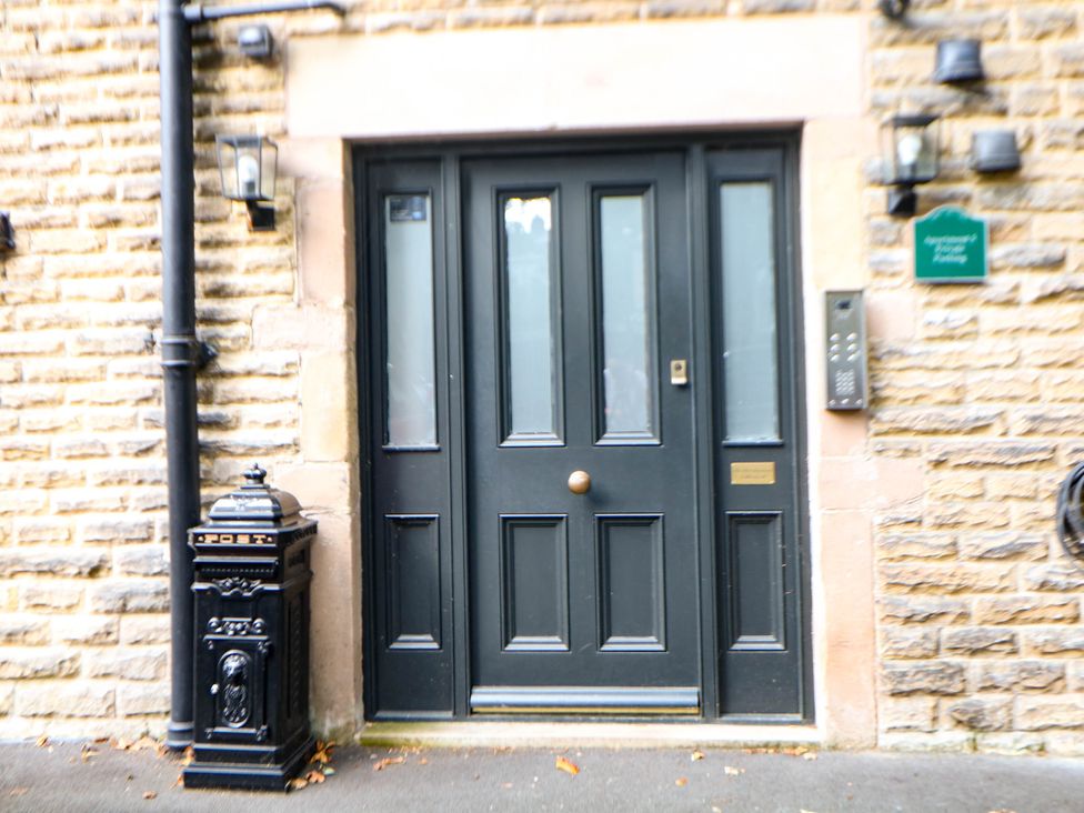 A main door with a mailbox beside it at Pavilion Suite Buxton