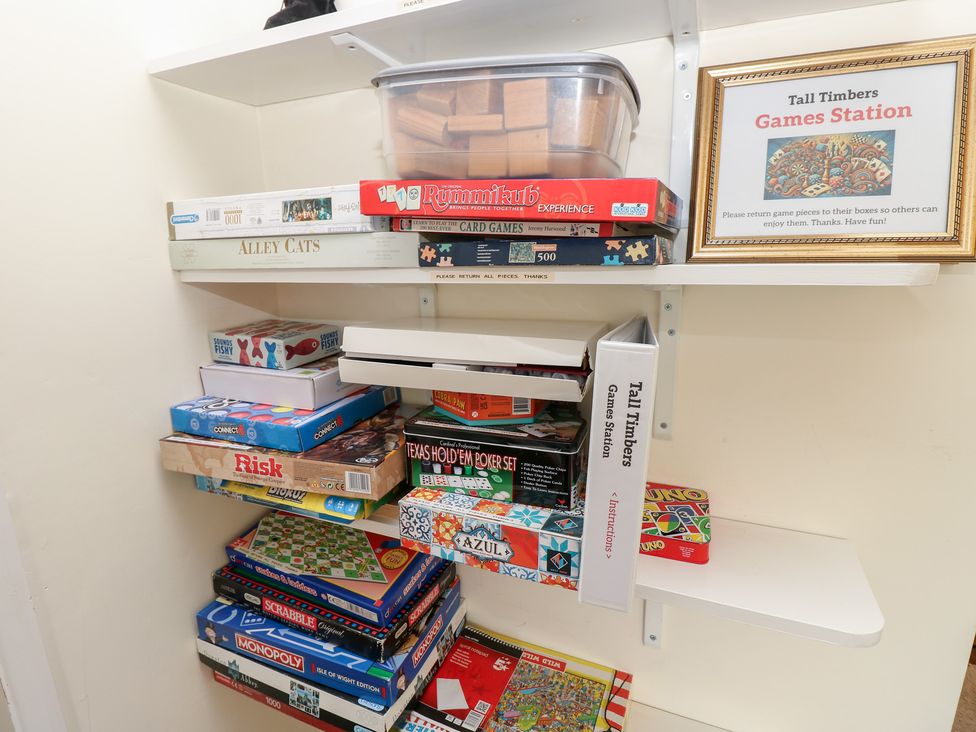 A game station with board games and card games at Tall Timbers in Ventnor