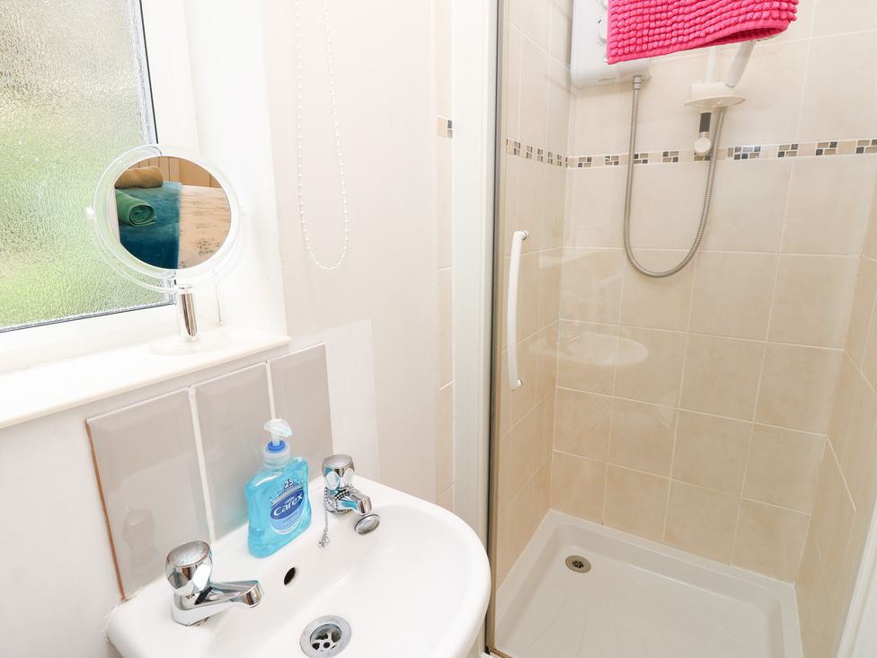A bathroom with a shower and sink at Tall Timbers in Ventnor