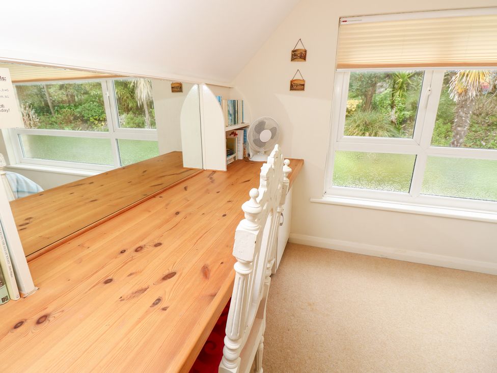 An office with a desk and fan at Tall Timbers in Ventnor
