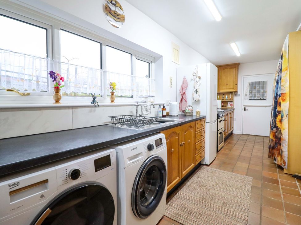 A kitchen with washing machine and dryer at Bryn Y Garreg - The Wireless Free Farm (No Tech!) Y Trallwng