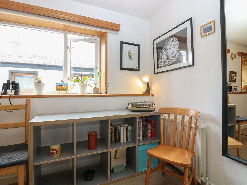 A study with a desk and chair at Footdee Cottage in Aberdeen