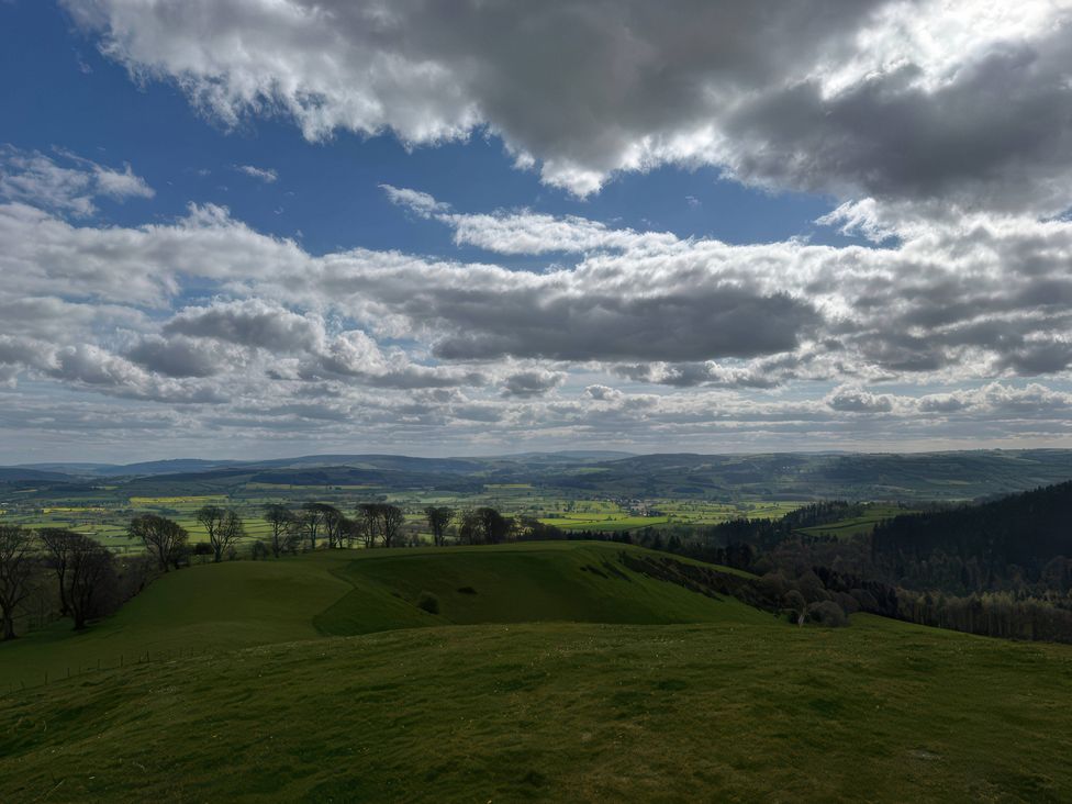 A landscape view with hills and cloudy sky at Beach Farmhouse near Bishop's Castle