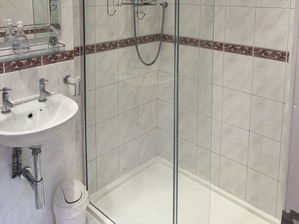 A bathroom with a shower and a sink at The Forge in Marksbury near Farmborough