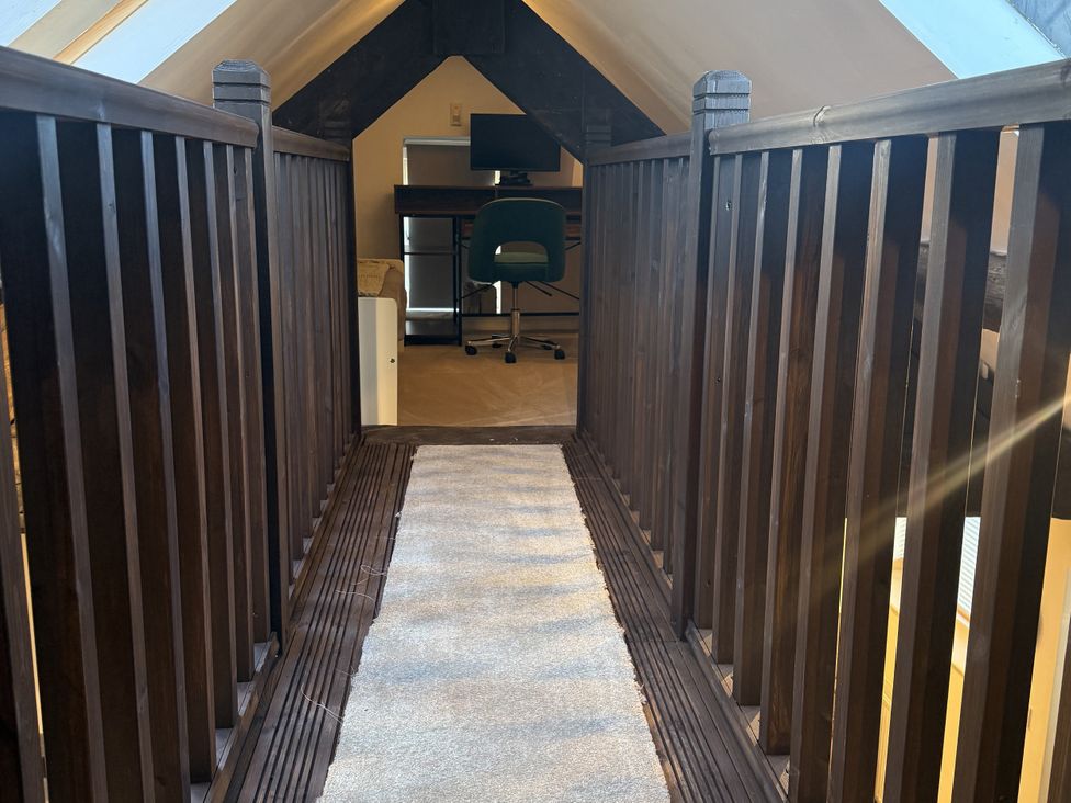 A loft area with a desk and chair at The Forge Marksbury near Farmborough