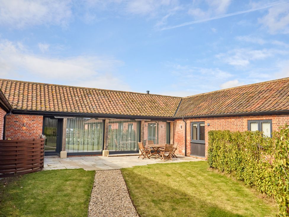 An outdoor area with a patio and seating at The Saddlery in Norwich