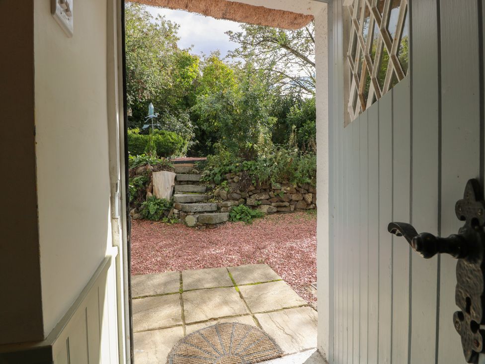 A view of a garden with steps and plants at Rowantree Cottage in Kelso