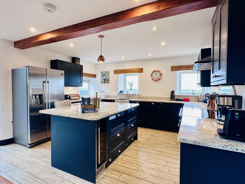 A kitchen with appliances and countertops at Pastures Barn Bradnop near Leek