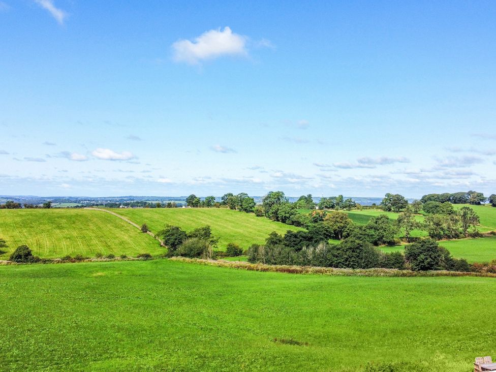 A scenic view of fields and trees at Pastures Barn in Bradnop near Leek