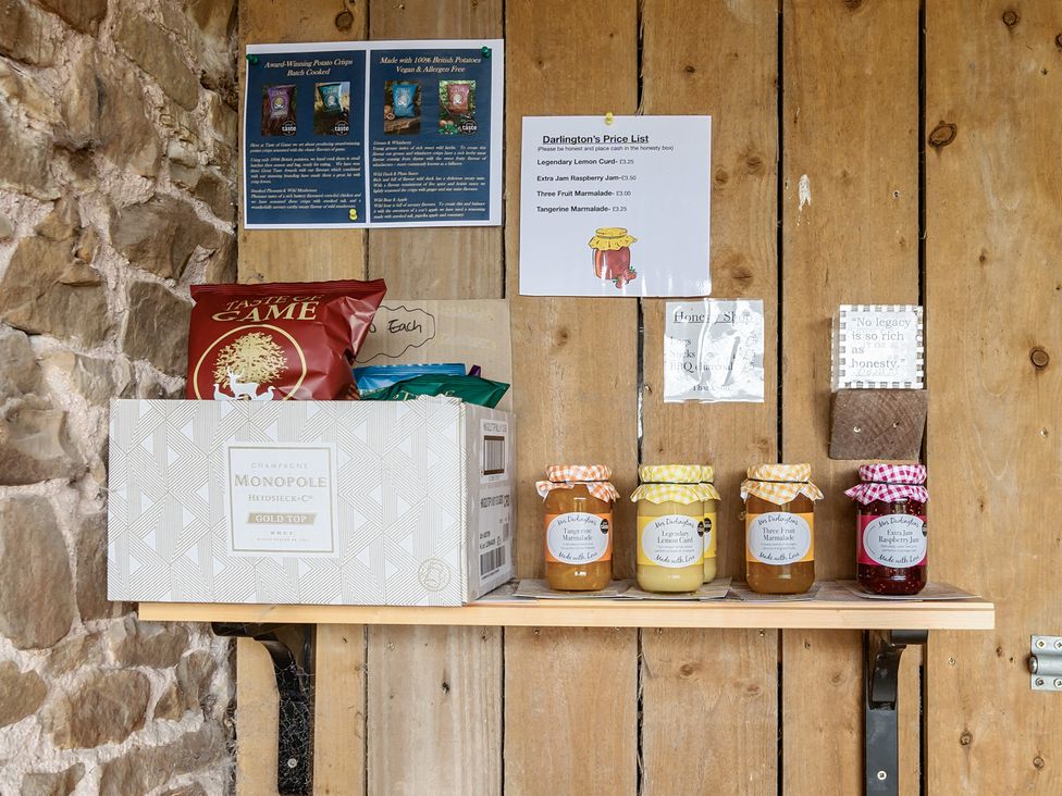 An outdoor stall with jars and snacks at HollyDale in Bradnop near Leek