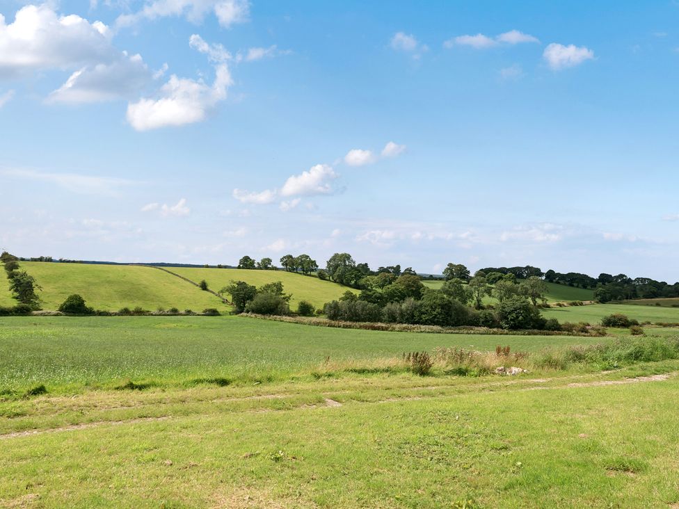 A landscape featuring green fields and trees at HollyDale in Bradnop near Leek