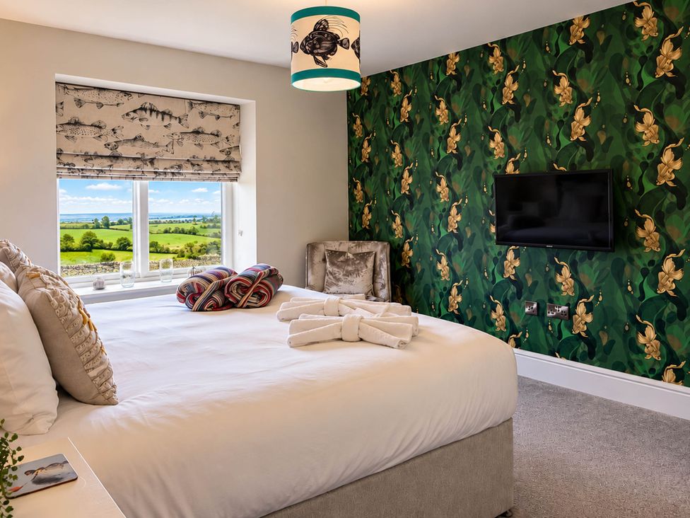A bedroom with a bed and a window at HollyDale in Bradnop near Leek
