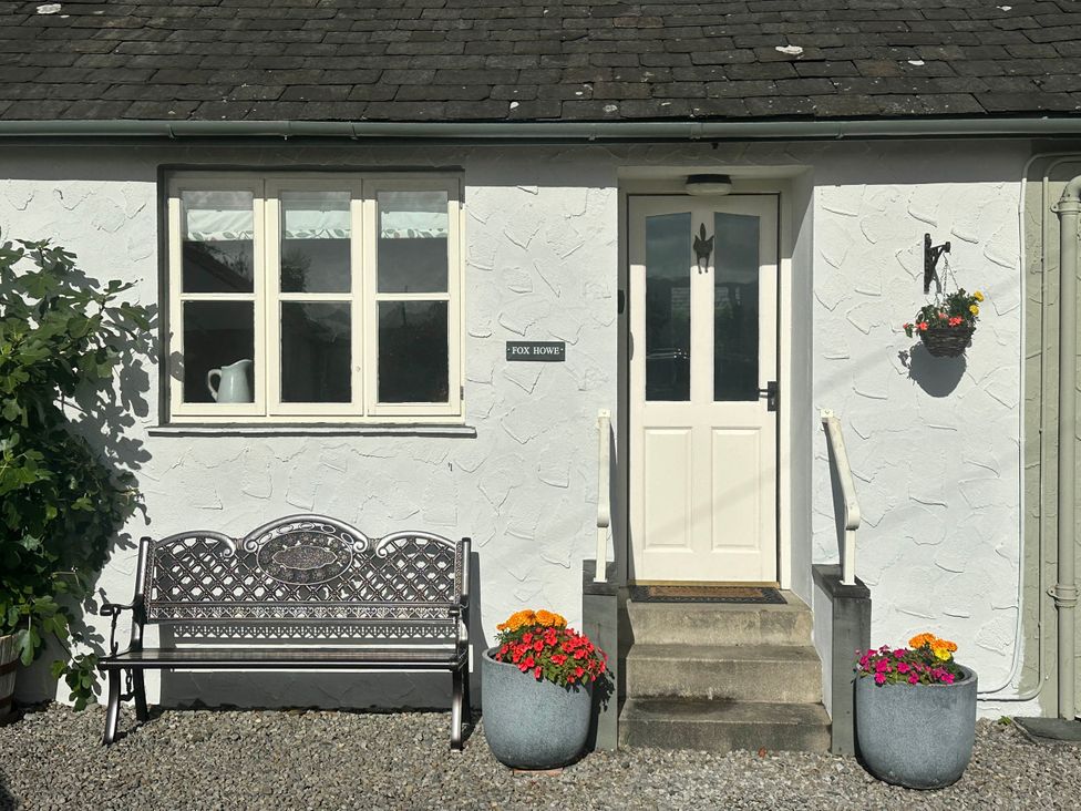 A bench in front of the entrance door at Fox Howe in Thornthwaite