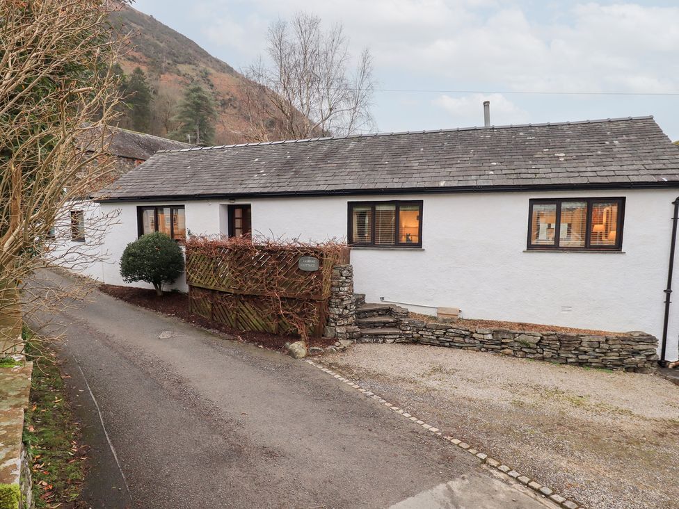A house with windows and a driveway at Jasmine Cottage Thornthwaite
