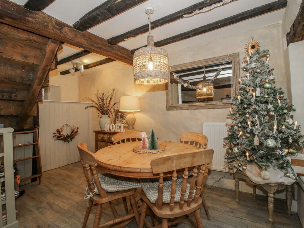 A dining room with a table and chairs at 8 Welsh Street Bishops Castle