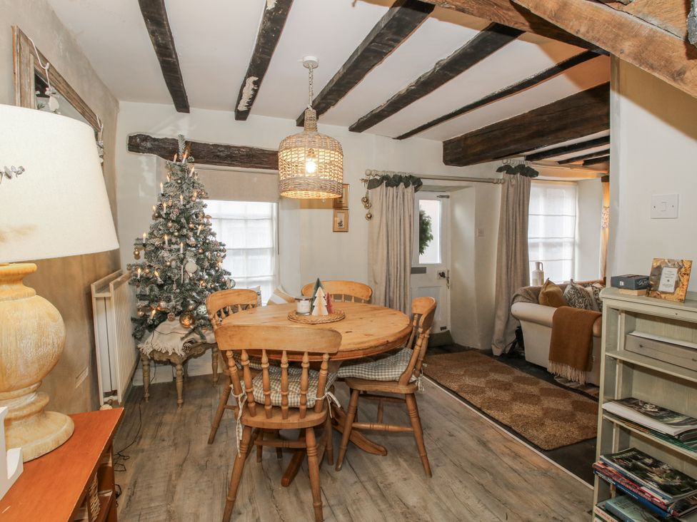 A dining room with a table and chairs at 8 Welsh Street in Bishops Castle