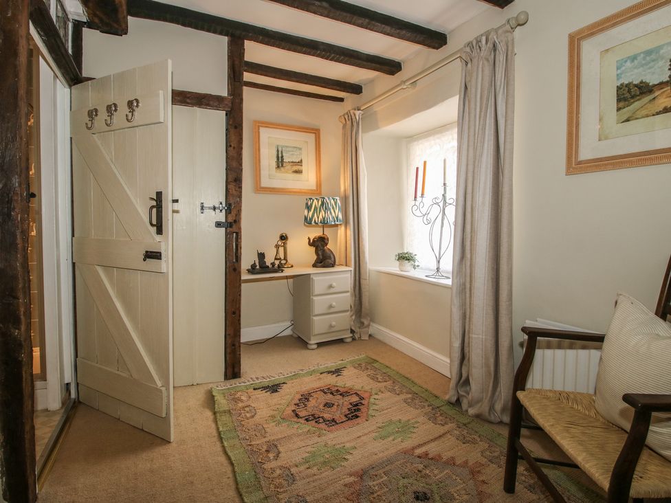 An entryway with a dresser and a lamp at 8 Welsh Street in Bishop's Castle