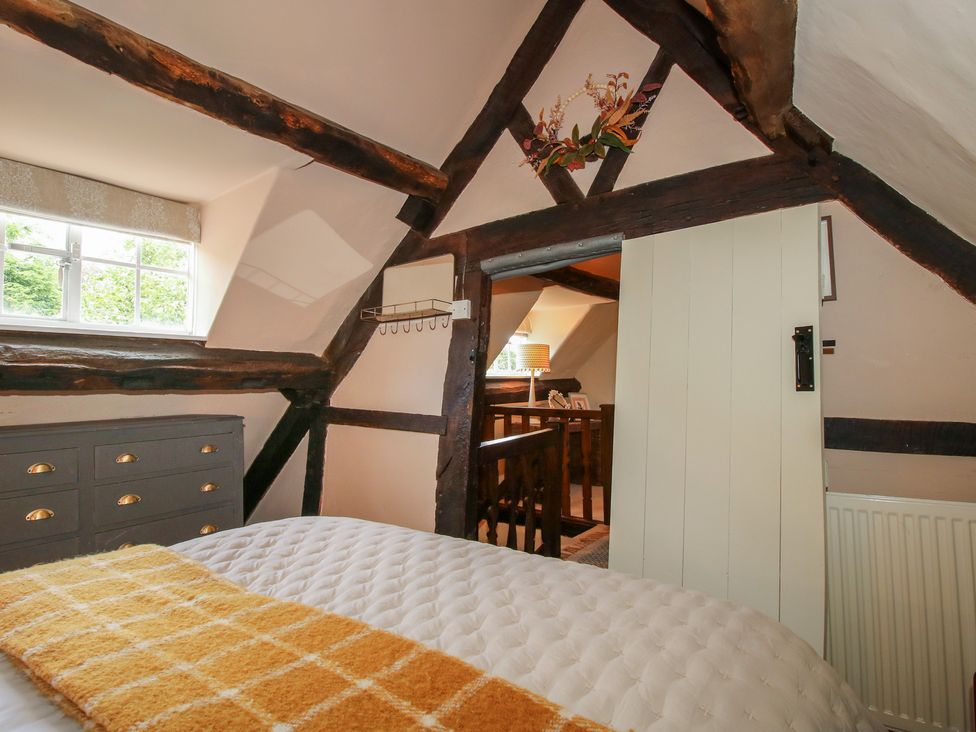 A bedroom with a dresser and a window at 8 Welsh Street in Bishop's Castle