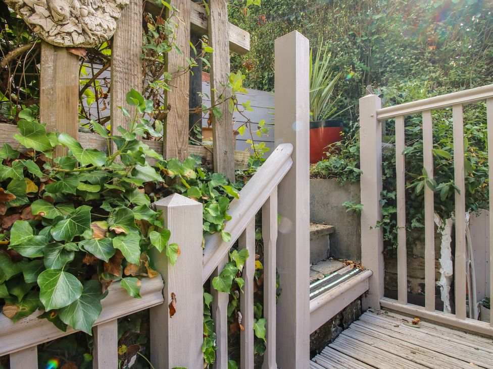 A garden with stairs and a fence at 8 Welsh Street in Bishop's Castle